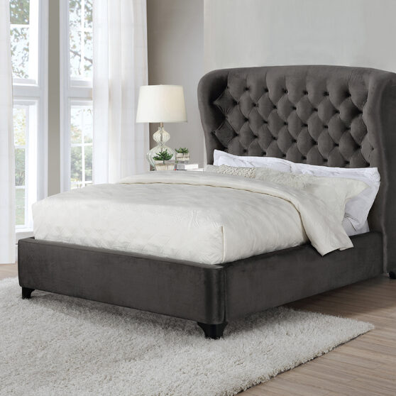 Queen bed upholstered in a gray fabric