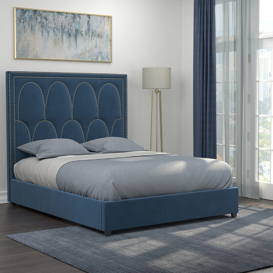 Queen bed upholstered in a rich blue velvet