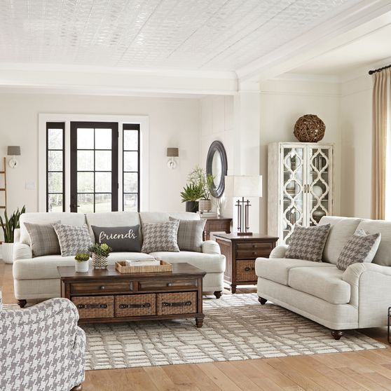Light gray casual style sofa with gray pillows