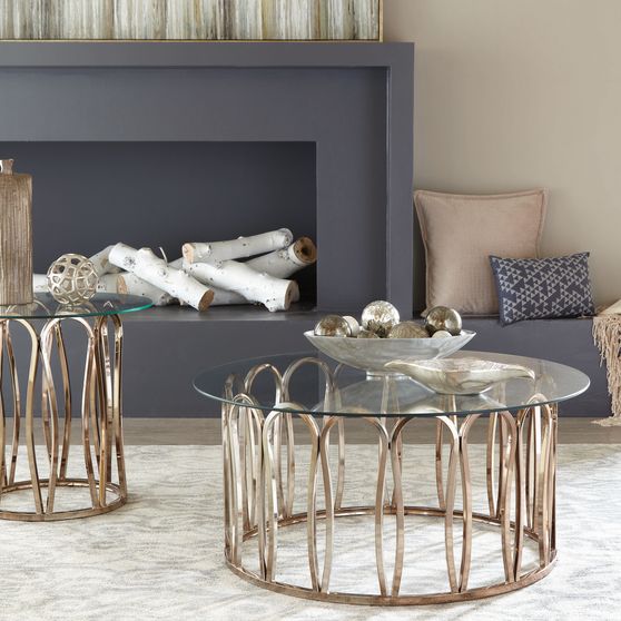 Round glass top / brass base coffee table