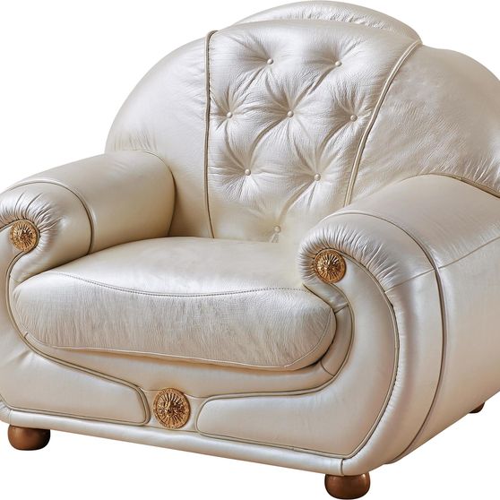 Full beige leather chair in classic tufted design