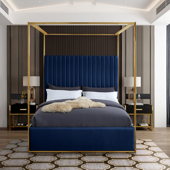 Navy blue channel tufted brushed brass canopy king bed