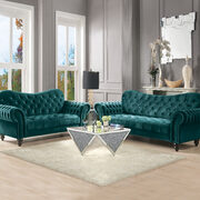 Green velvet sofa in glam style