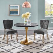Round wood top dining table in black gold