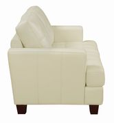 Affordable cream faux leather sofa additional photo 2 of 8