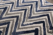 Large-print 'z' pattern accents contrasting ottoman additional photo 2 of 2
