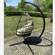 Rattan swing hammock egg chair with beige cushion and pillow additional photo 2 of 12