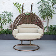 Taupe cushion and dark brown wicker hanging 2 person egg swing chair additional photo 4 of 9