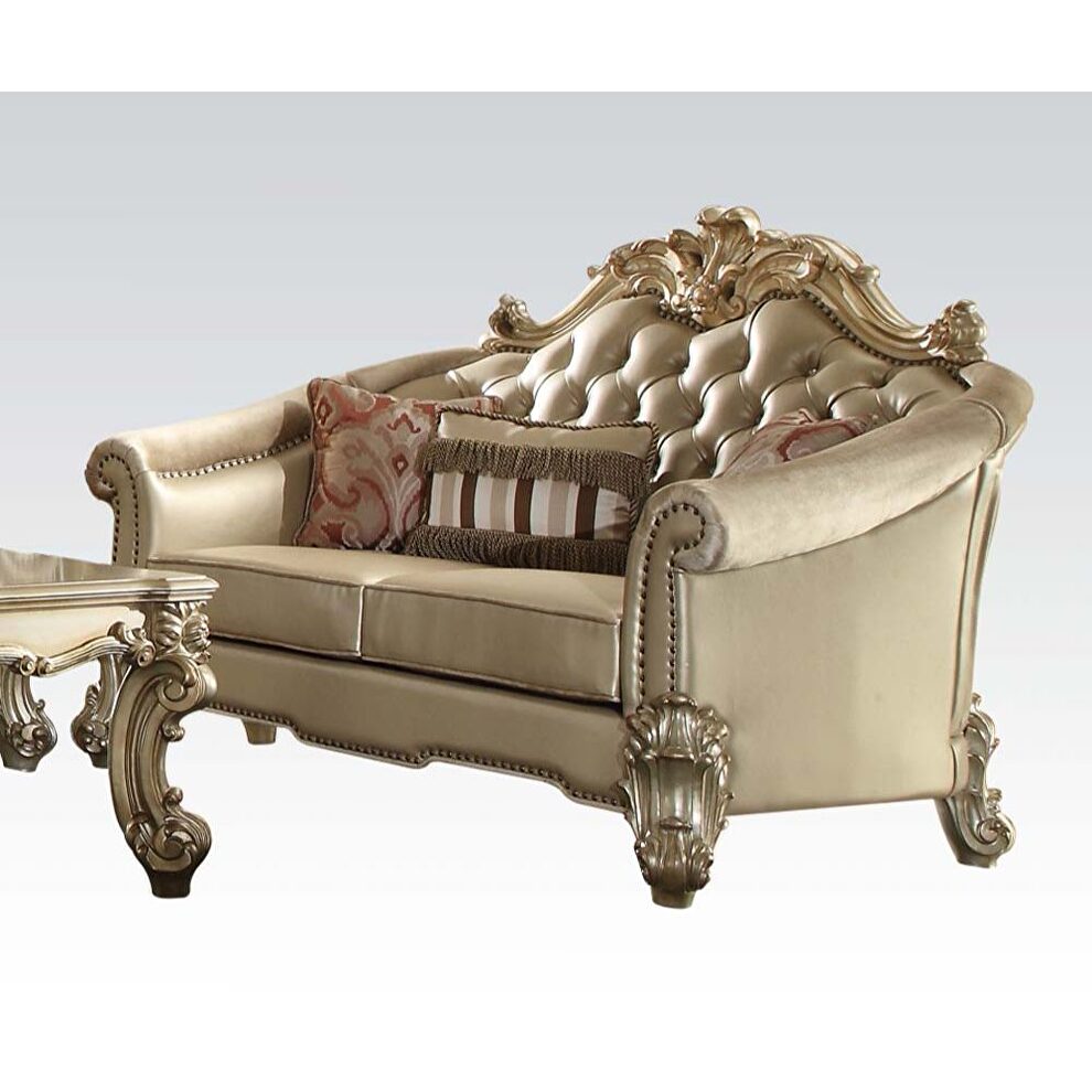 Gold patina finish bone pu tufted loveseat by Acme