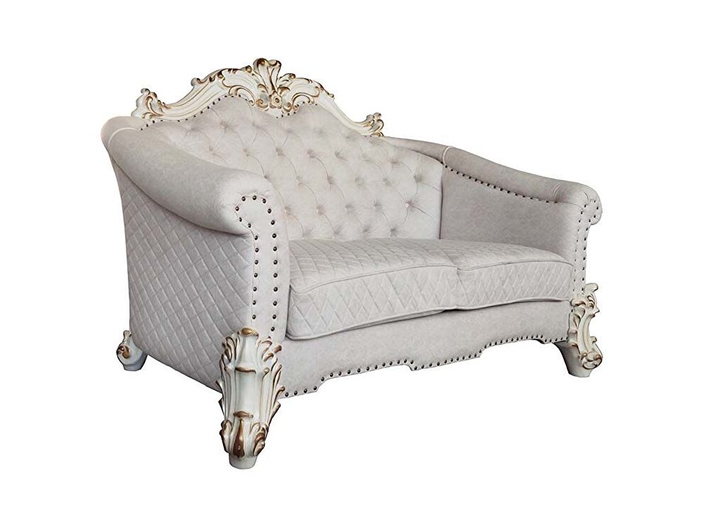 Two tone ivory fabric & antique pearl finish crystal like button tufting loveseat by Acme