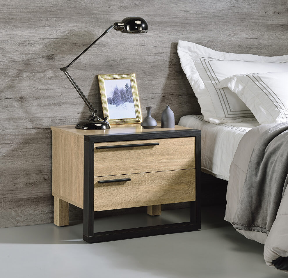 Natural wood tone paired with metal hardware in a rich black finish  accent table by Acme