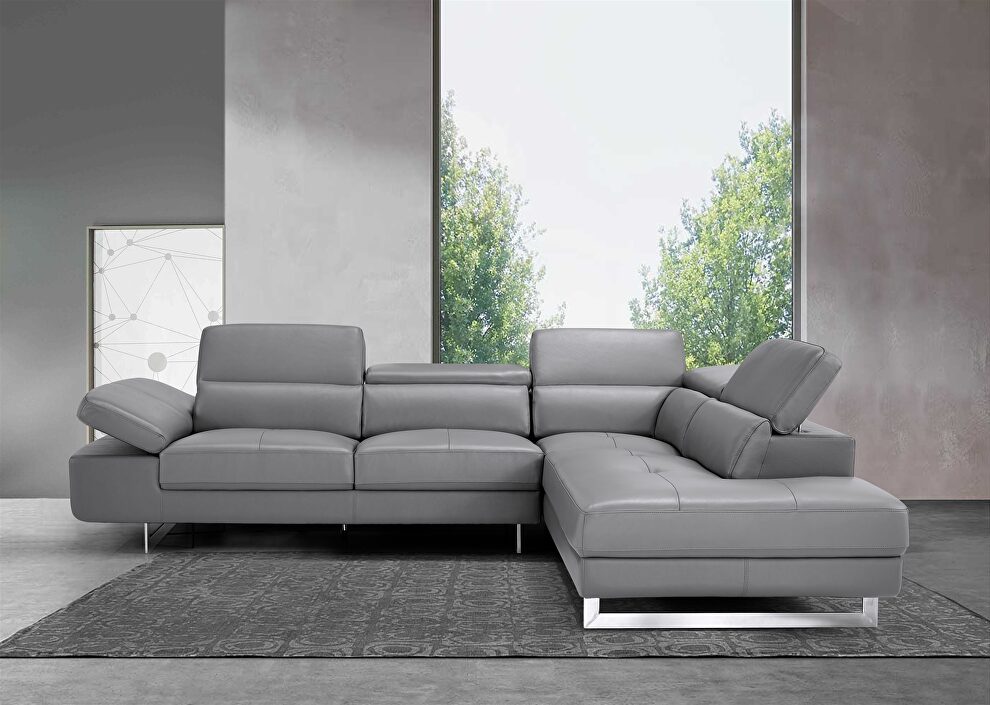 Dark gray leather right-facing sectional w/ moving headrests by Beverly Hills