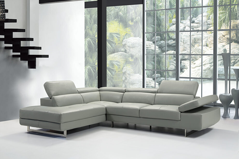 Light gray leather left-facing sectional w/ moving headrests by Beverly Hills