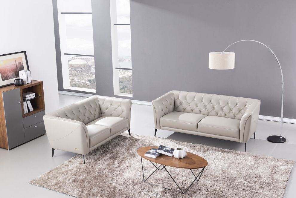 Smoke gray leather tufted back sofa by Beverly Hills