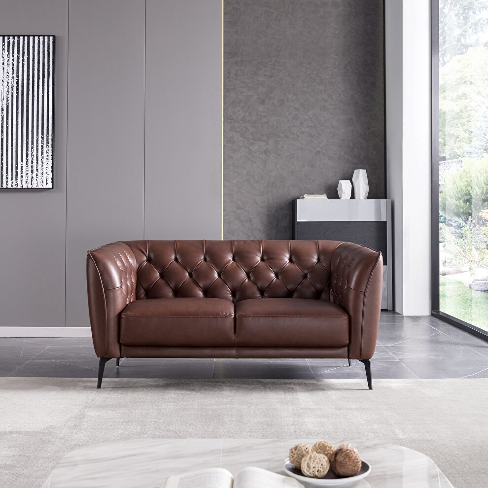 Brown leather tufted back loveseat by Beverly Hills