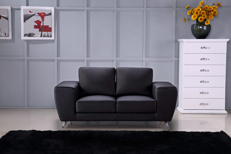 Ultra-contemporary black leather loveseat w/ metal legs by Beverly Hills