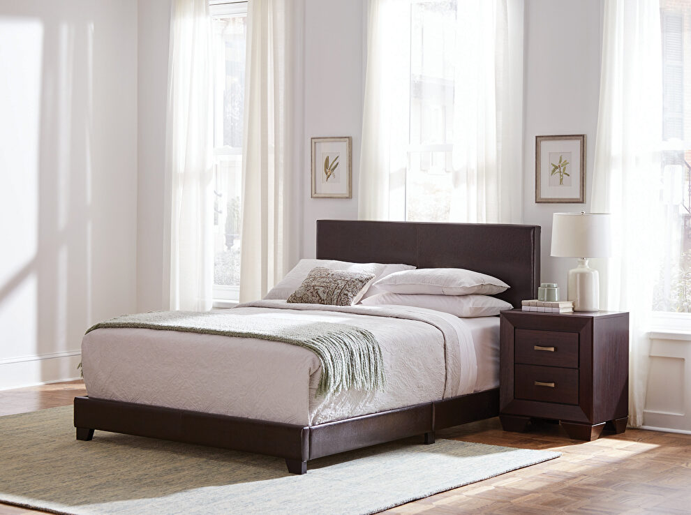 Brown faux leather upholstered king bed by Coaster