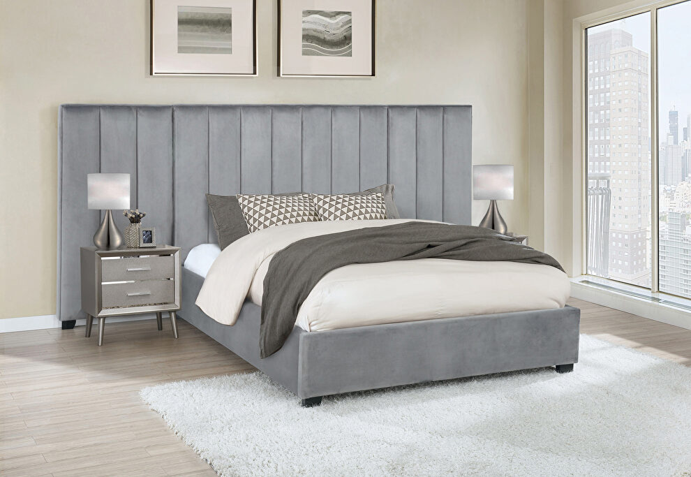 Eastern king bed upholstered in a gray velvet fabric by Coaster
