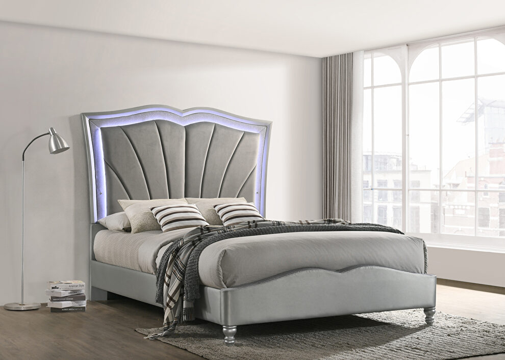 Eastern king bed upholstered in a light gray velvet fabric by Coaster
