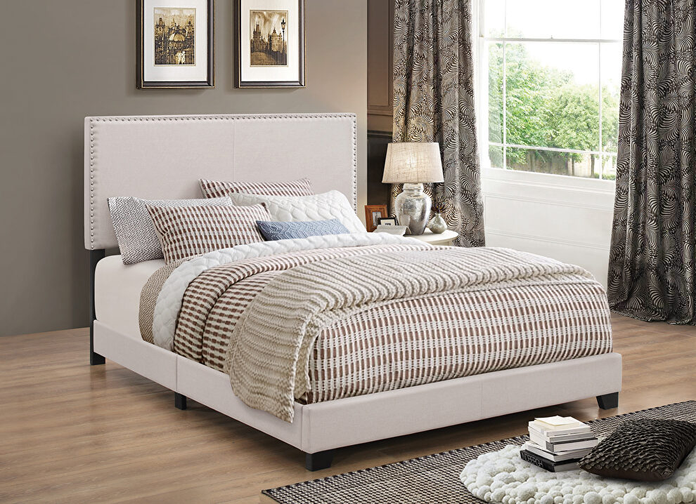 Upholstered ivory king size bed by Coaster
