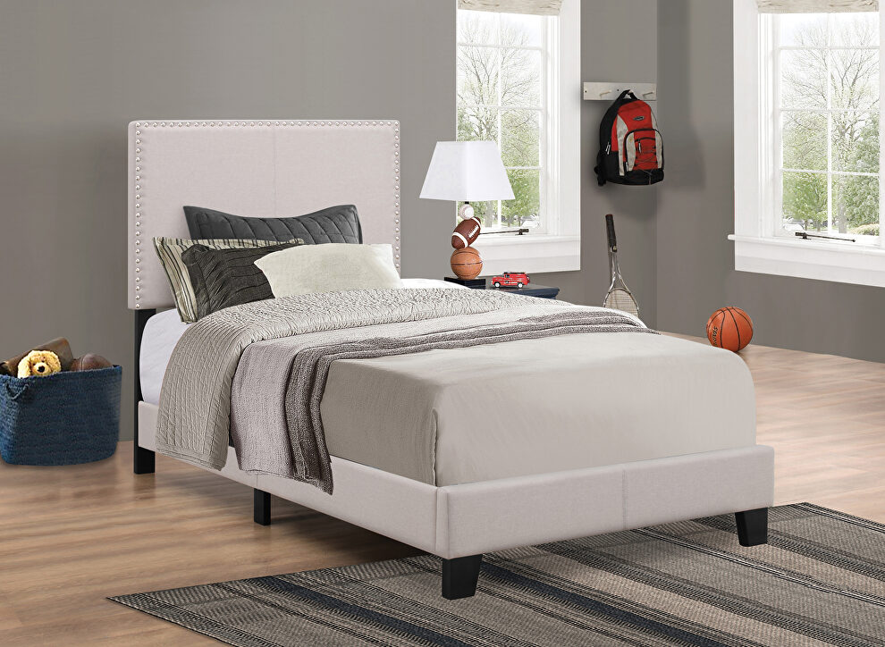 Upholstered ivory twin bed by Coaster