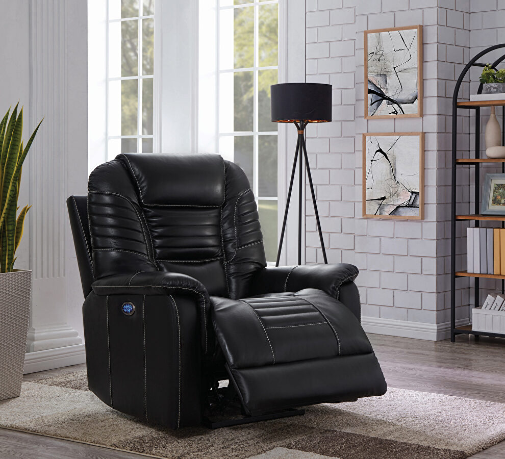 Power recliner upholstered in black top grain leather by Coaster