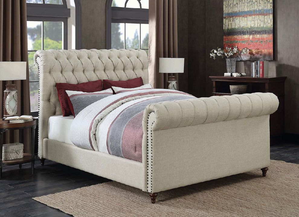 Beige upholstered queen bed by Coaster