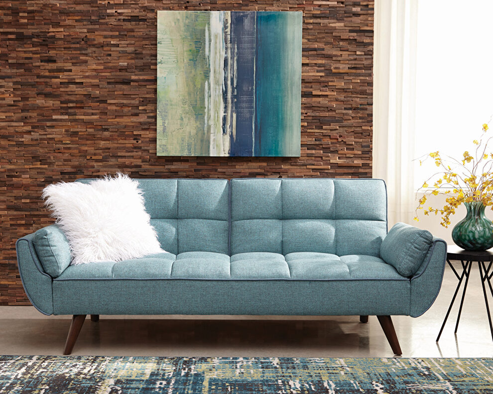 Sofa bed upholstered in a rich turquoise blue fabric by Coaster