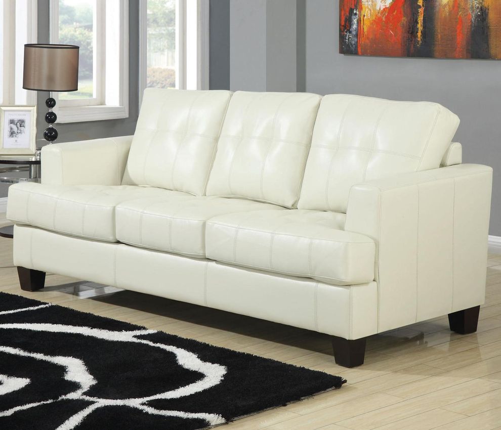 Cream leather sofa bed w/ pull-out sleeper by Coaster