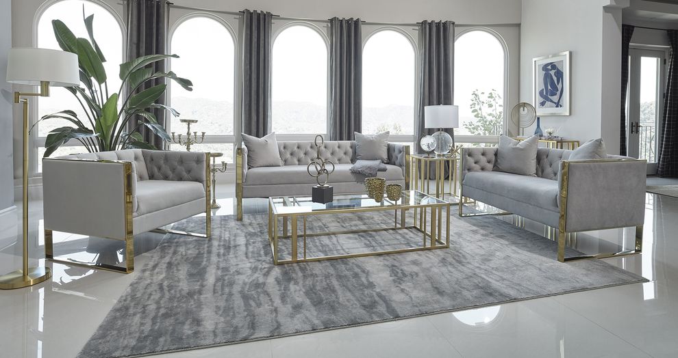 Glam style gray tufted sofa w/ golden steel legs by Coaster