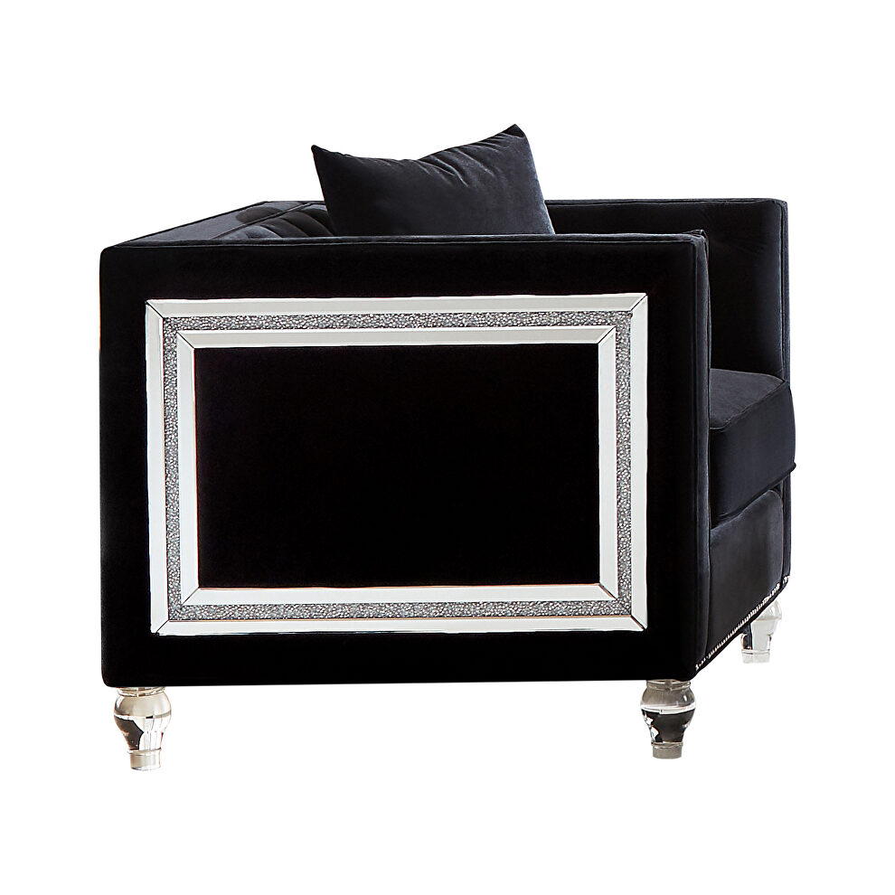 Chair upholstered in a luxurious black velvet by Coaster
