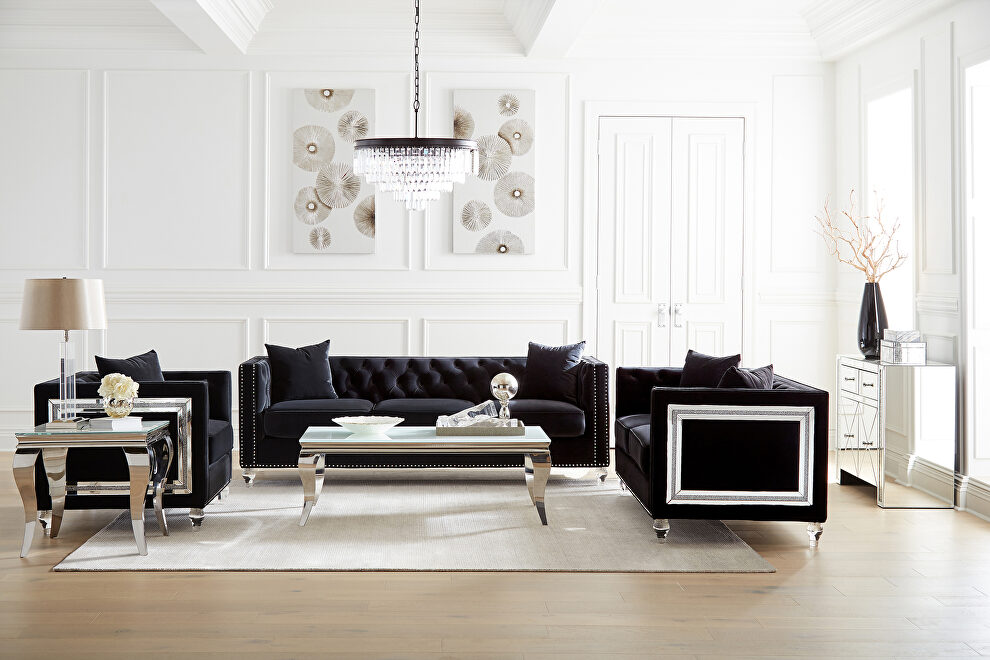 Sofa upholstered in a luxurious black velvet by Coaster