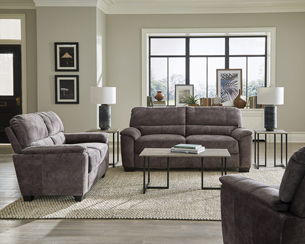 Velvety soft upholstery in a marbled charcoal gray sofa by Coaster