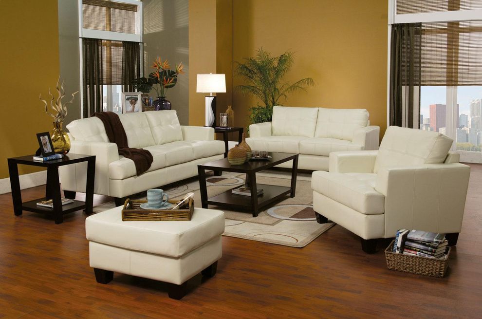 Affordable cream faux leather sofa by Coaster