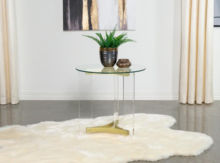 Round glass top end table with acrylic legs clear and matte brass by Coaster