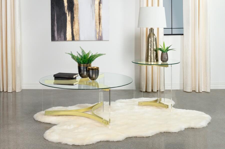 Round glass top coffee table with acrylic legs clear and matte brass by Coaster