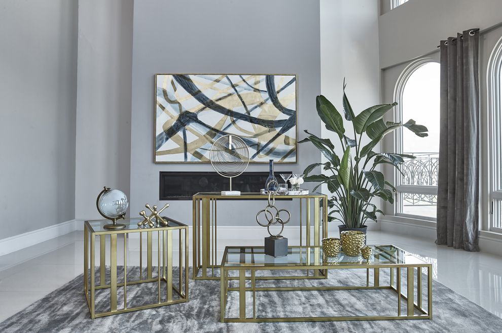 Glass top / brass metal legs coffee table by Coaster