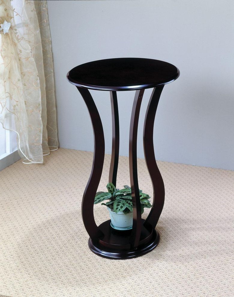 Black plant accent table by Coaster