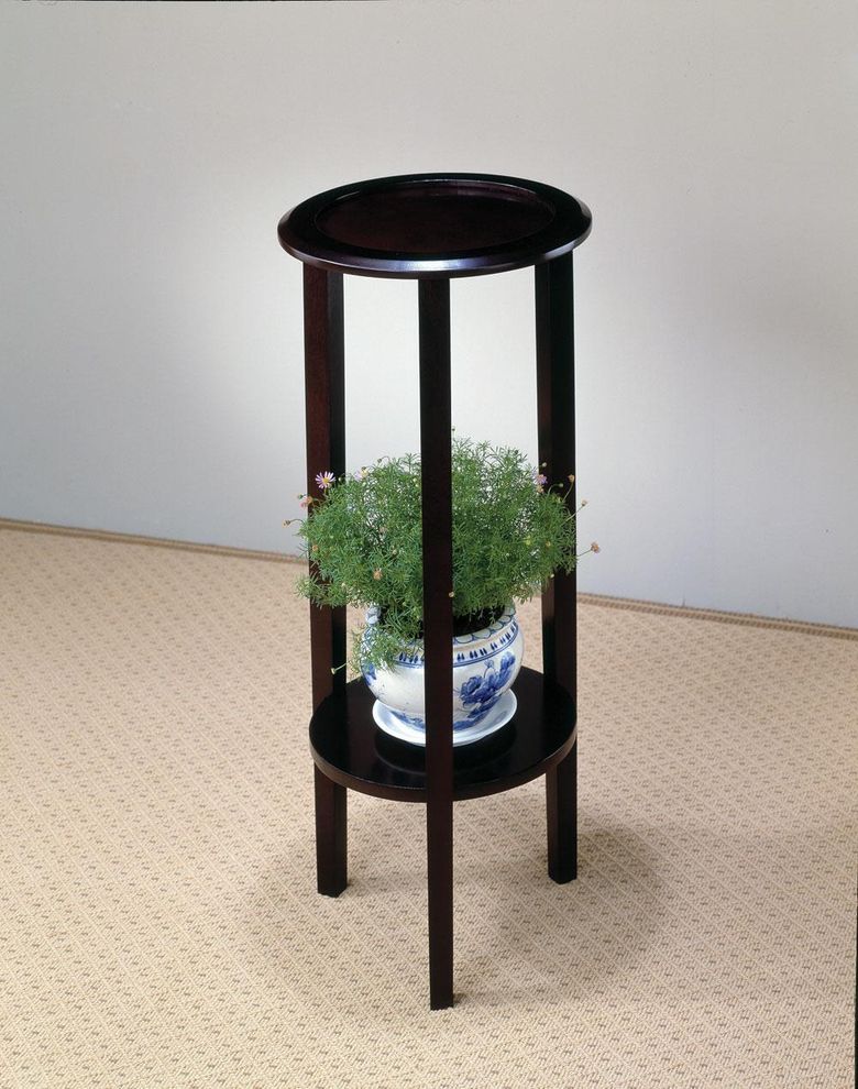 Black round plant accent table by Coaster