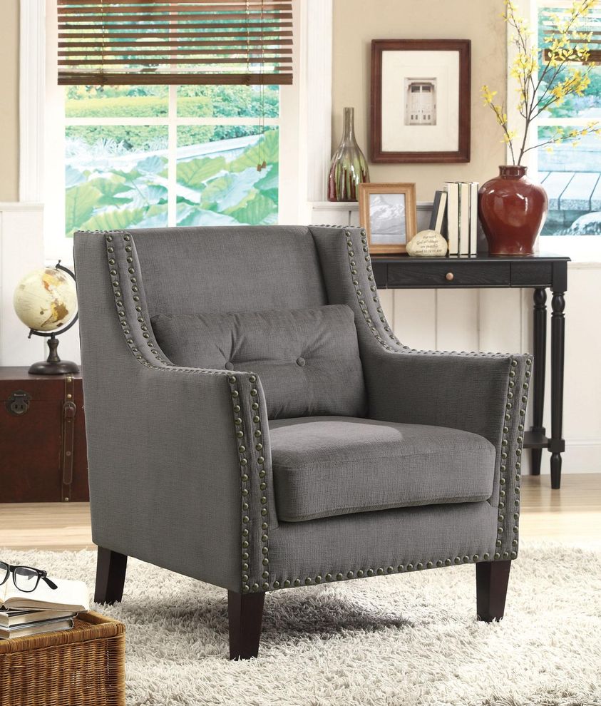 Accent chair with nailhead trim and accent pillow by Coaster