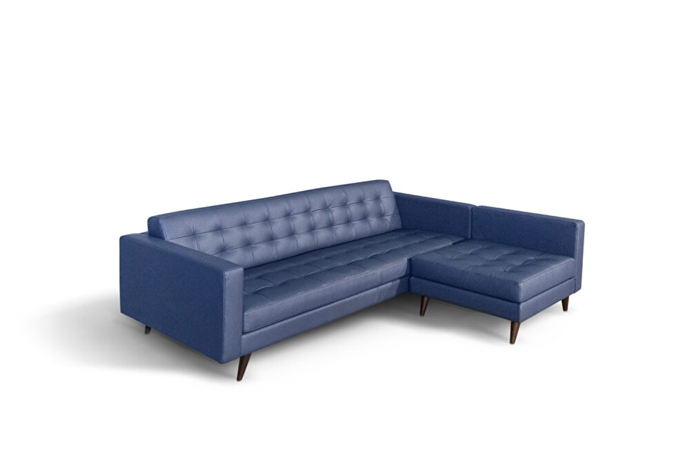 Contemporary tufted sectional sofa in prussia blue leather by Diven Living