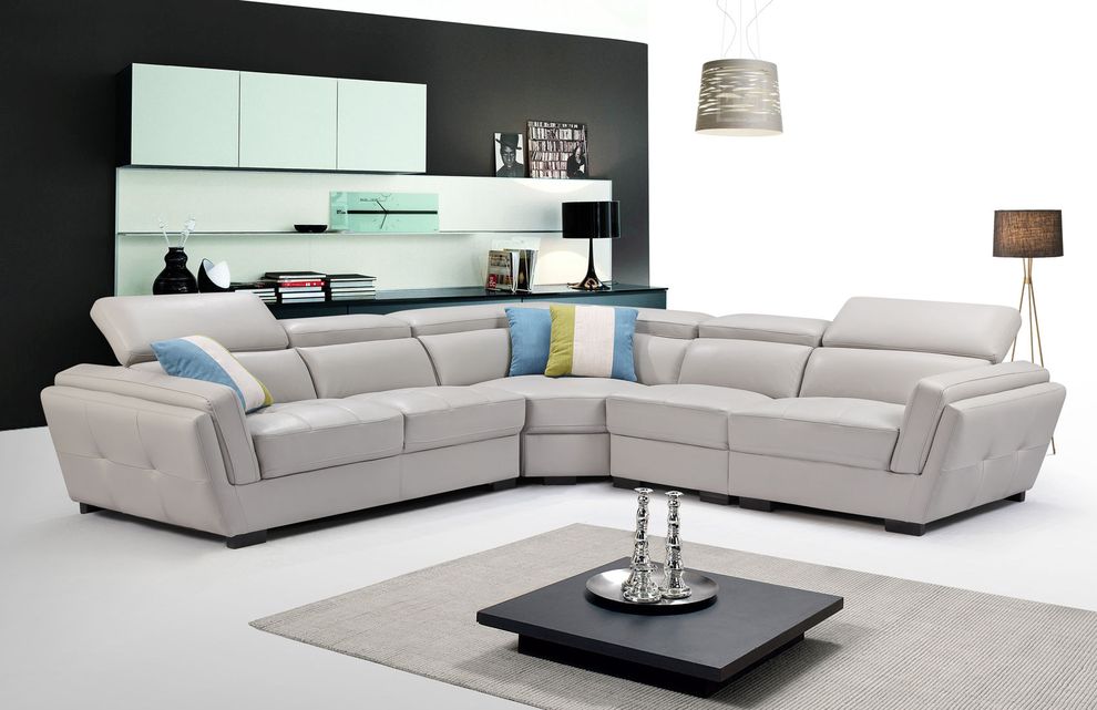 Light gray leather sectional w/ adjustable headrests by ESF