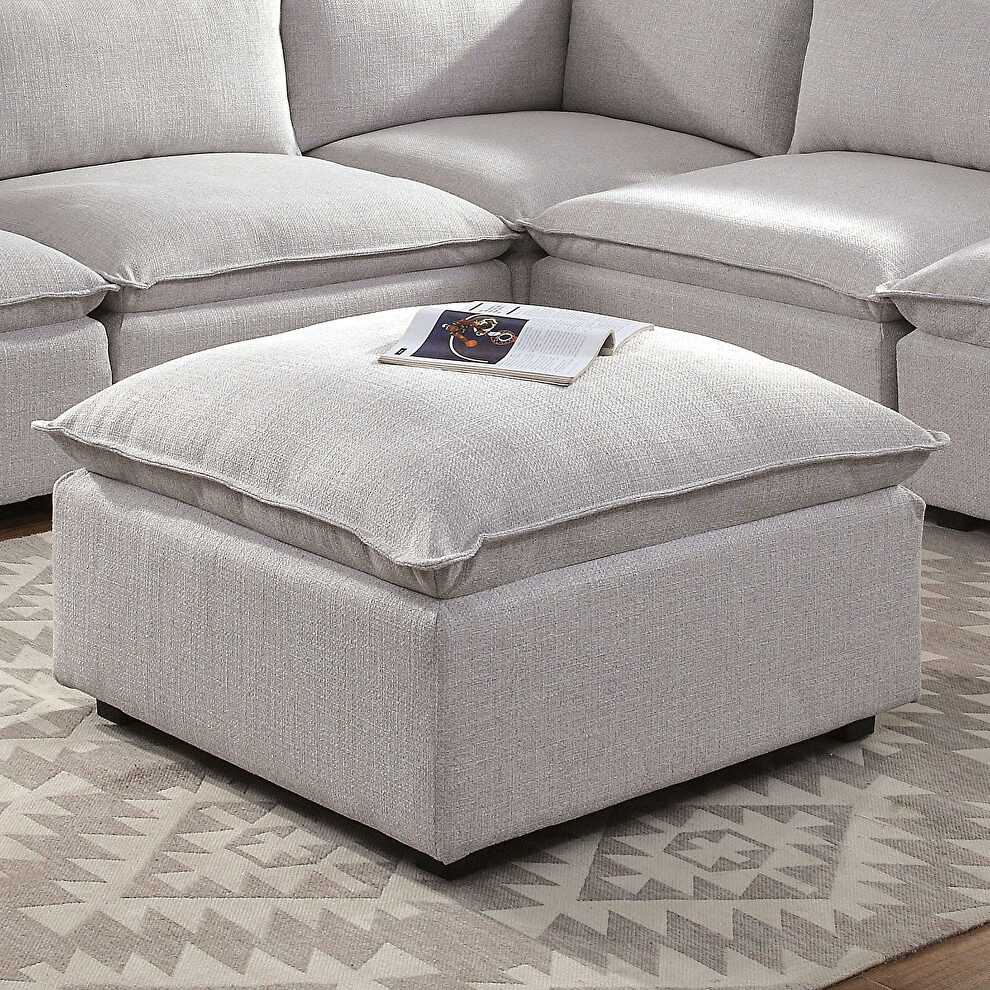 Light gray extra-plush upholstered ottoman by Furniture of America