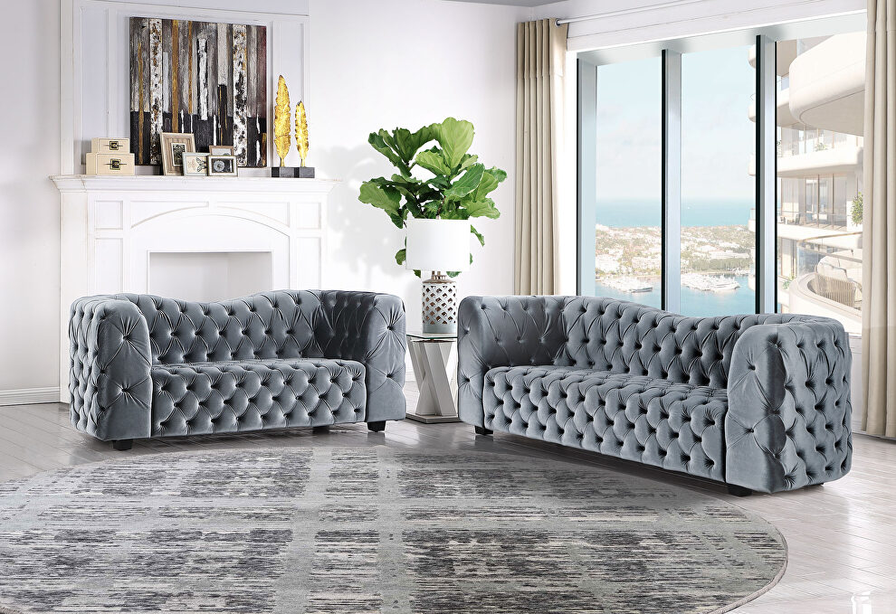 Grey velvet sofa with elegant tufted seats and back by Global
