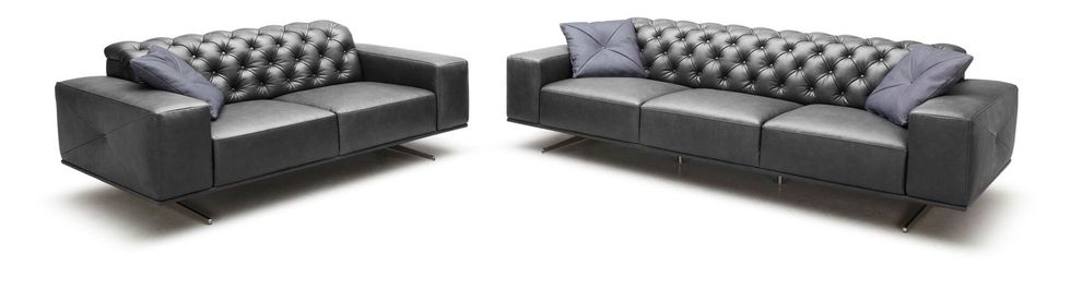 Contemporary leather sofa with dense tufted back by J&M