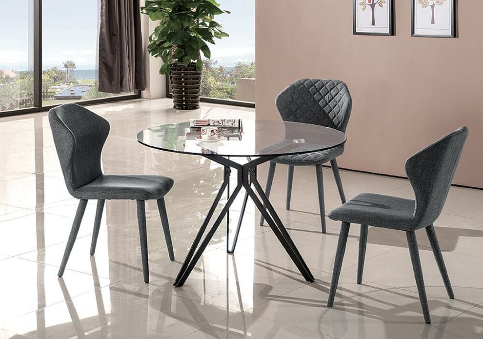 Sophisticated round glass top dining table by J&M