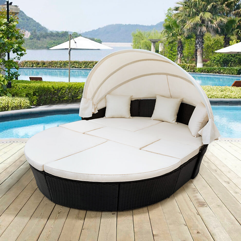 Beige outdoor rattan daybed sunbed with retractable canopy wicker furniture, round outdoor sectional sofa set by La Spezia
