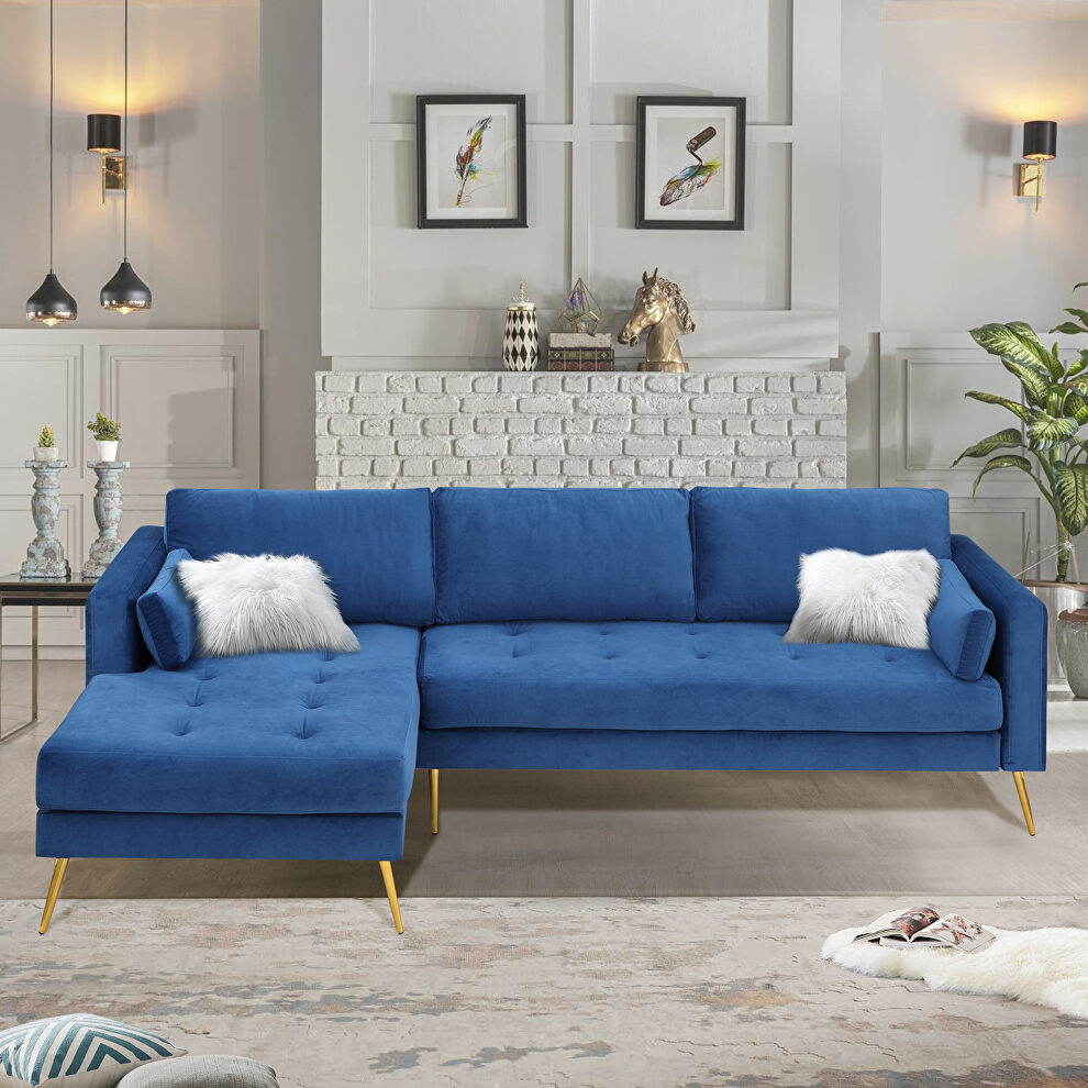 Modern elegant blue velvet sectional sofa with two pillows by La Spezia