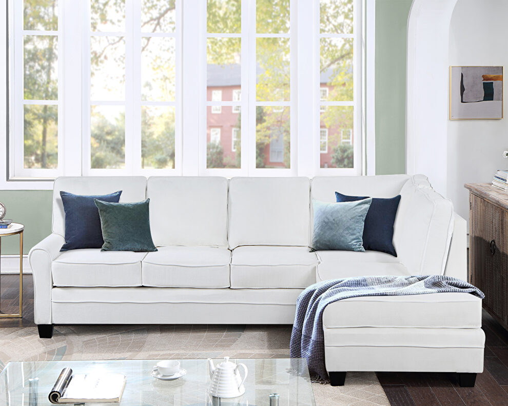 White linen upholstered reversible sectional sofa with scrolled arm by La Spezia