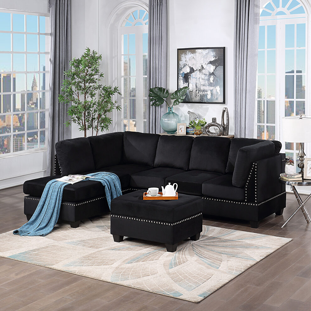 Black velvet reversible sectional sofa with storage ottoman by La Spezia
